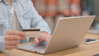 © stockbakers - Male Hands doing Online Payment on Laptop, Close up