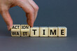 © Dzmitry - Action or wait time symbol. Businessman turns wooden cubes and changes words wait time to action time. Beautiful grey background, copy space. Business and action or wait time concept.