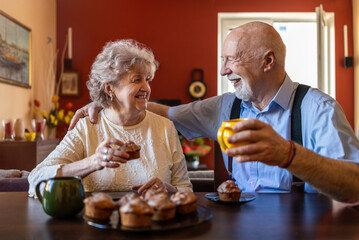 Wall Mural - Portrait of a happy senior couple spending quality time together at home
