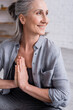 © LIGHTFIELD STUDIOS - happy mature woman with grey hair and praying hands