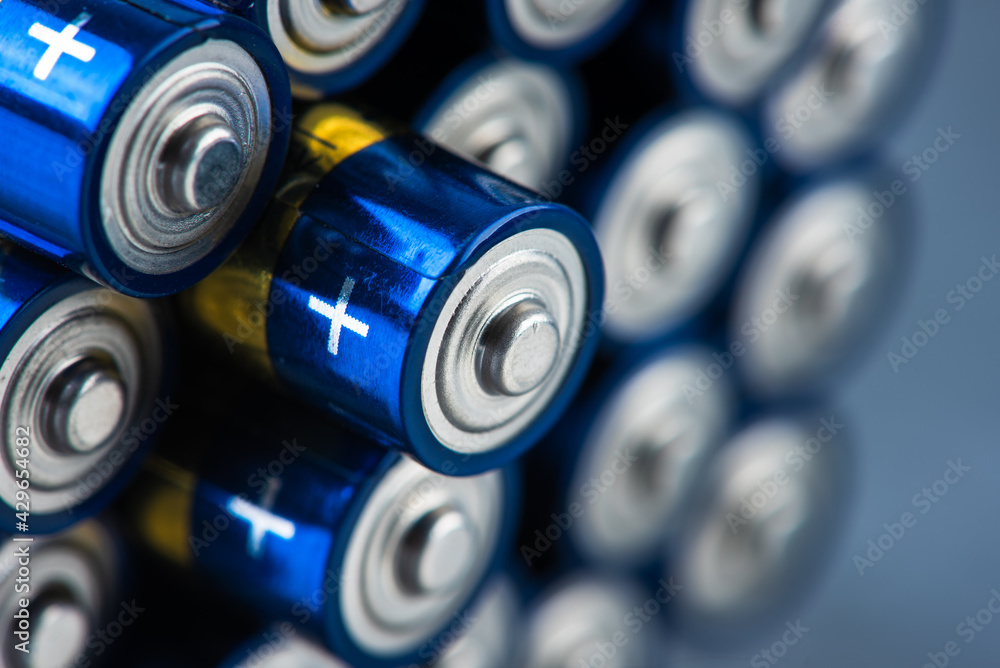 Alkaline battery size AAA with selective focus close-up - obrazy, fototapety, plakaty 