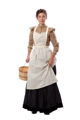 Young prairie woman with apron holding skirt and a basket isolated on white