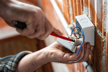 Electrician At Work On A Residential Electrical System. Electricity.