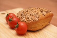 Bread And Tomatoes On Table