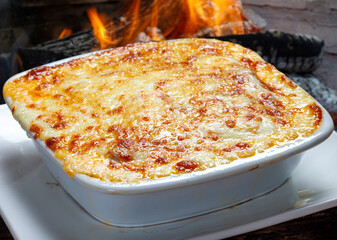 Wall Mural - Lasagna Bolognese baked in the wood oven