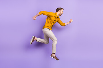 Sticker - Full length profile side photo of young man happy positive smile jump go walk run hurry isolated over purple color background