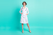 Full length body size photo of nurse smiling wearing white coat glasses isolated on vivid turquoise color background