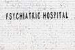 Black chalkboard with inscription psychiatric hospital on in