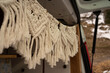Closeup shot of macrame hanging in a car trunk