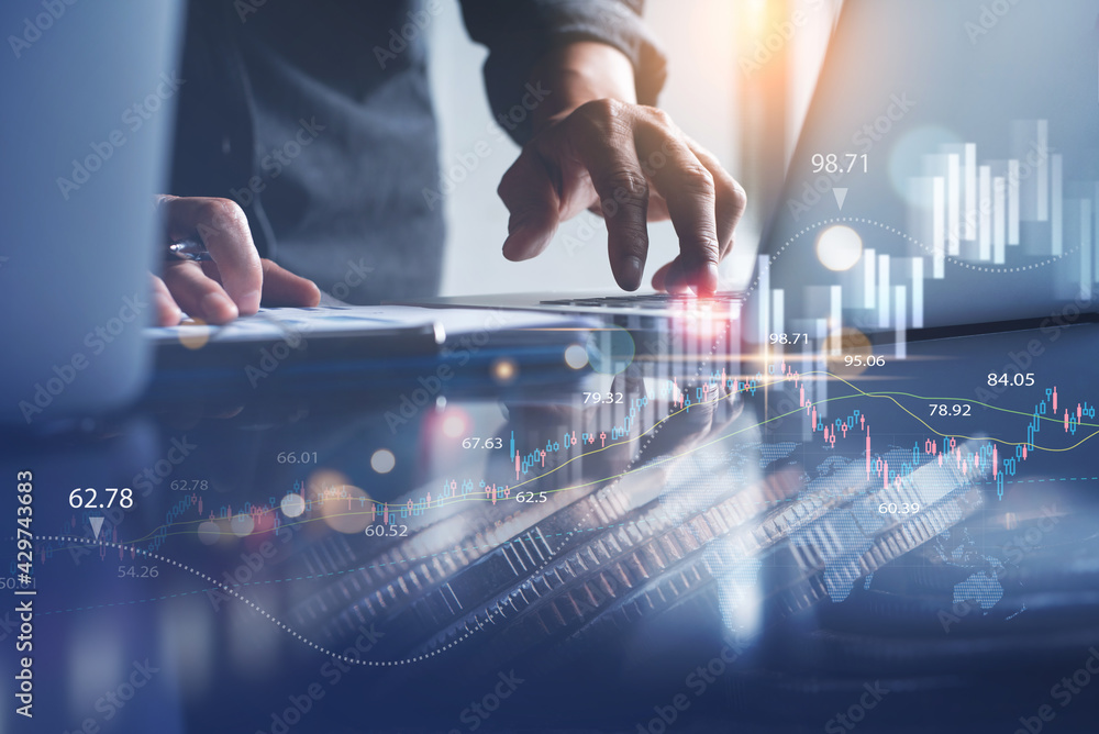 Businessman using laptop computer and digital tablet analyzing sales data and economic growth, financial graph chart. Business strategy analysis