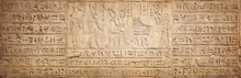 Old Egyptian Hieroglyphs On An Ancient Background. Wide Historical Background. Ancient Egyptian Hieroglyphs As A Symbol Of The History Of The Earth.