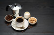 Cup of espresso coffee, mocha coffee maker milk or cream and brown sugar on dark wooden background