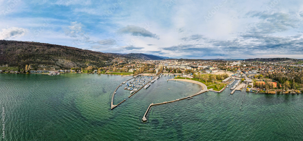 Panoramic aerial view over Lake Biel with a view of the city of Biel Bienne and the city's bank and port. Canton Bern, Switzerland - obrazy, fototapety, plakaty 