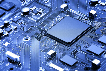 part of the main circuit board close-up. light blue tinted background or wallpaper on the theme of e