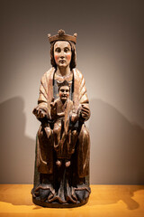 Wooden sculpture of a church representing the mother of god and the child