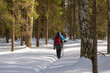 © Valery Smirnov - A group of tourists in a winter snow forest on a sunny day.