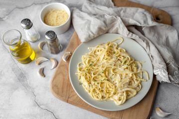 Wall Mural - Alfredo pasta dinner with creamy white sauce with herbs seasoning. Pasta made in Italian restaurant called Alfredo. Cheese Alfredo Pasta.