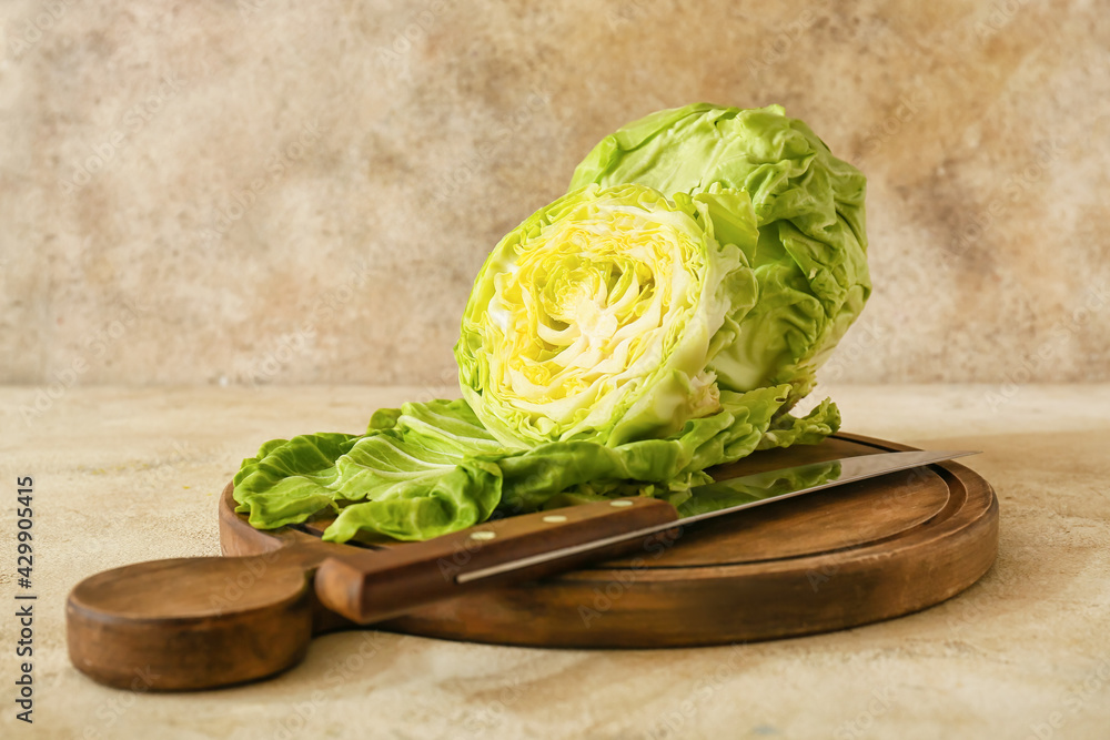 Board with fresh cut cabbage on color background Stock Photo | Adobe Stock