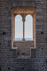 Old vintage window on an ancient facade. No people