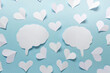 © dariaren - Paper valentine love affection composition with two brain silhouettes and many white paper hearts on blue background