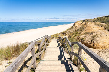 Wall Mural - wooden boardwalk near the rotes kliff (red cliff), sylt, schleswig-holstein, germany