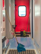 The concept of clean long-distance trains. A mop, a bucket and a rag stand in the empty entrance inside the train.