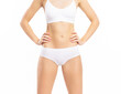 © Acronym - Close-up of a beautiful and fit female figure. Studio photo of young woman's body in swimsuit.