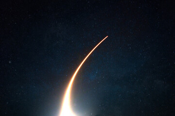 Fototapete - Rocket with a light blast flies and takes off into space in the starry sky. Spaceship launch on a dark background, concept.