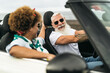 © Alessandro Biascioli - Happy senior couple having fun driving on new convertible car - Mature people enjoying time together during road trip tour vacation - Elderly lifestyle and travel culture transportation concept
