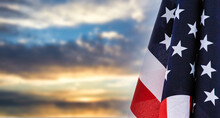 Patriotic United States Of America Flag At Rest Before A Beautiful Sky With Room For Text And Cropping. Social Media Or Web Banner Or Header. 