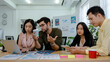 © khwanchai - brainstorming and planning business team of young start up, group of people brief and analyze document on table, teamwork and creative concept