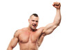 Happy bodybuilder enjoying victory. Smiling shirtless excited muscular healthy young man in good shape with hand in fist. White background, studio shot.