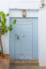 Picturesque entrance to a house in the white town of Vejer de la Frontera, Andalusia, Spain