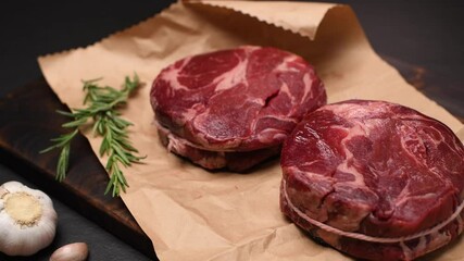 Poster - Fresh raw pieces of beef meat on a cutting board