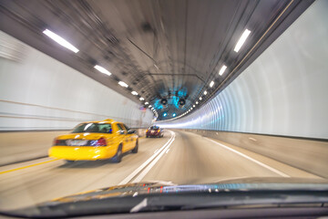 Wall Mural - Taxi speeding up along Miami tunnel, blurred fast motion