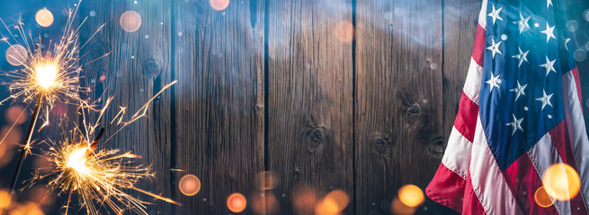 4th Of July - American Flag With Sparklers And Smoke On Rustic Wooden Background - Independence Day Celebration Concept