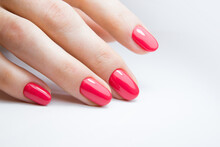 Female Hand With Beautiful Manicure With Red Gel Polish