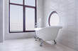 © farmuty - Modern, stylish white bathroom with bathtub . Trendy round and panoramic windows overlooking the sea, ocean. Spa, wellness treatments. Health, body care, relaxation, leisure. Luxury home interior