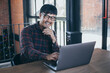 © panitan - asian man work using computer hand typing laptop keyboard contact us.student study learning education online.adult professional people chatting search at office.concept for technology device business
