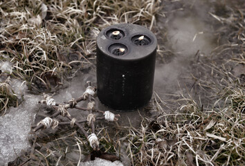 Wall Mural - Black candle and pentagram on the ice in winter.