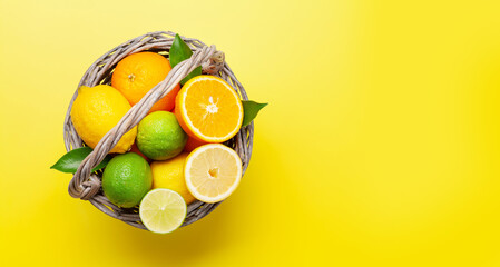 Wall Mural - Fresh ripe citrus fruits on yellow background