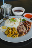 Fototapeta Mapy - Stewed pork leg on rice at restaurant, Thai food