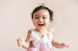 © DUSITARA STOCKER - Portrait of a cute happy little Asian baby girl who recently had baby tooth laughing and look at camera, baby expression concept