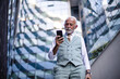 © liderina - Senior business man talking on smart phone.