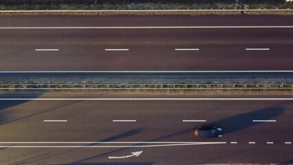 Wall Mural - Aerial view over the highway at sunset.