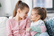 © Syda Productions - family, childhood and friendship concept - two happy smiling little girls or sisters at home