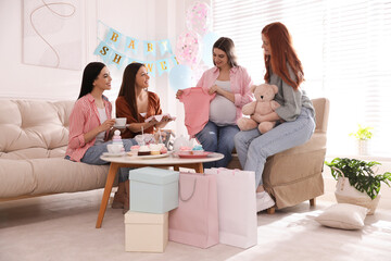 Poster - Happy pregnant woman spending time with friends at baby shower party