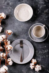 A blue modern ceramic plate with silver fork