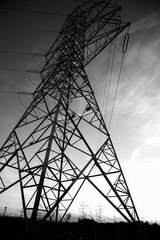 electricity pylon in the countryside at sunset