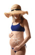 © New Africa - Pregnant woman with sun protection cream on her belly against white background